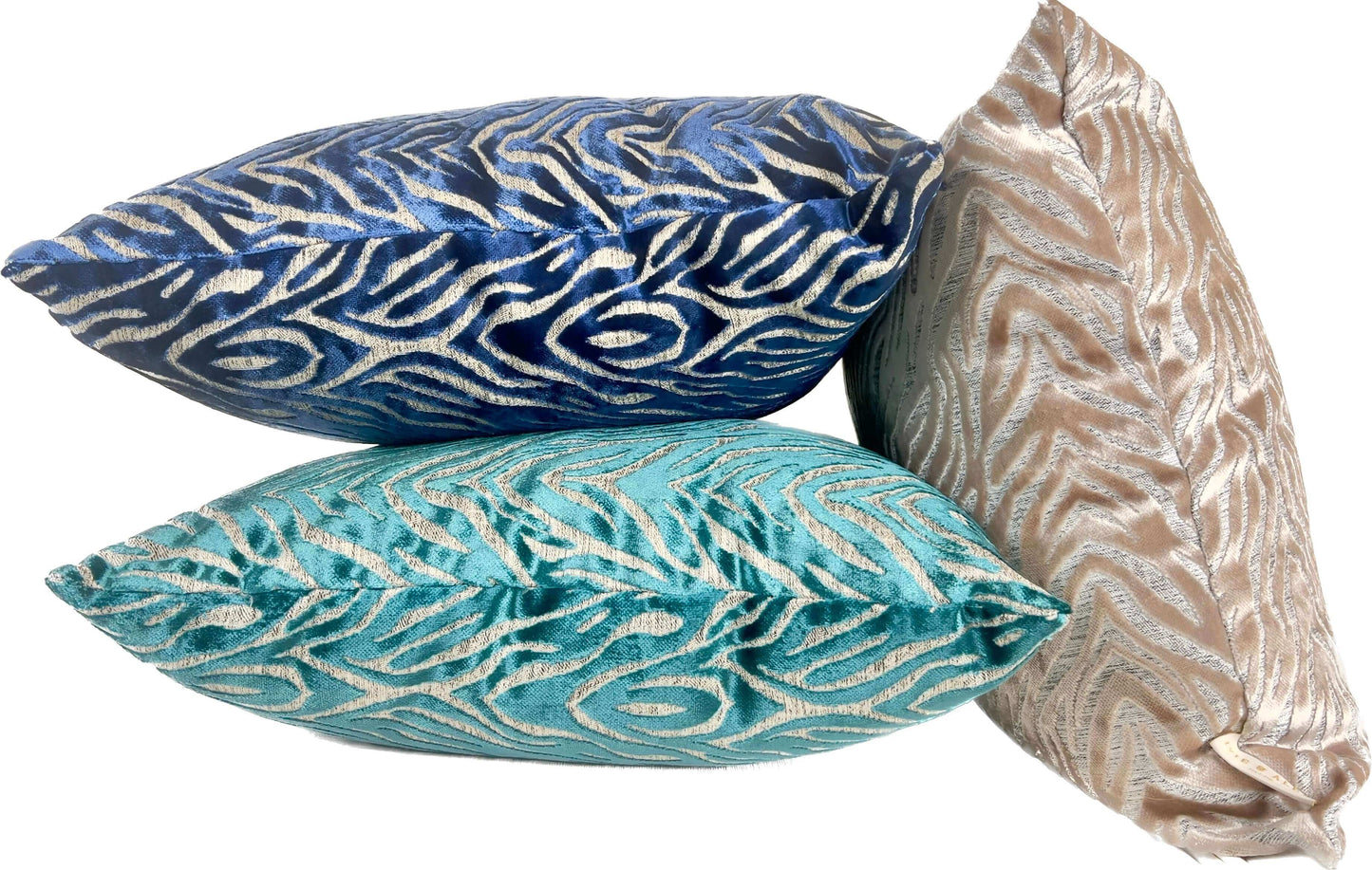 Beige Tiger Pattern Cut Velvet Pillow Cover with two other pillows against a white background