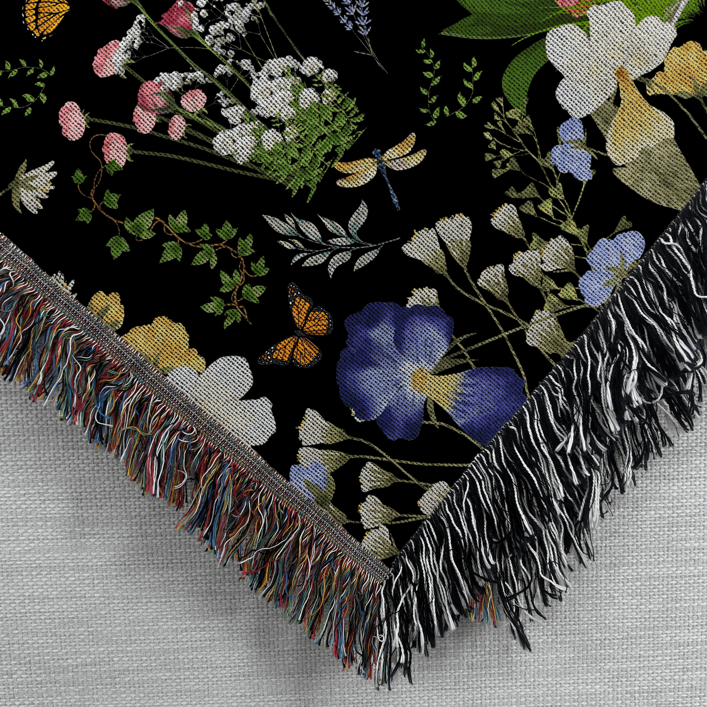 Black Peacock Floral Woven Blanket with Fringes featuring intricate floral designs and colorful details on a black background.