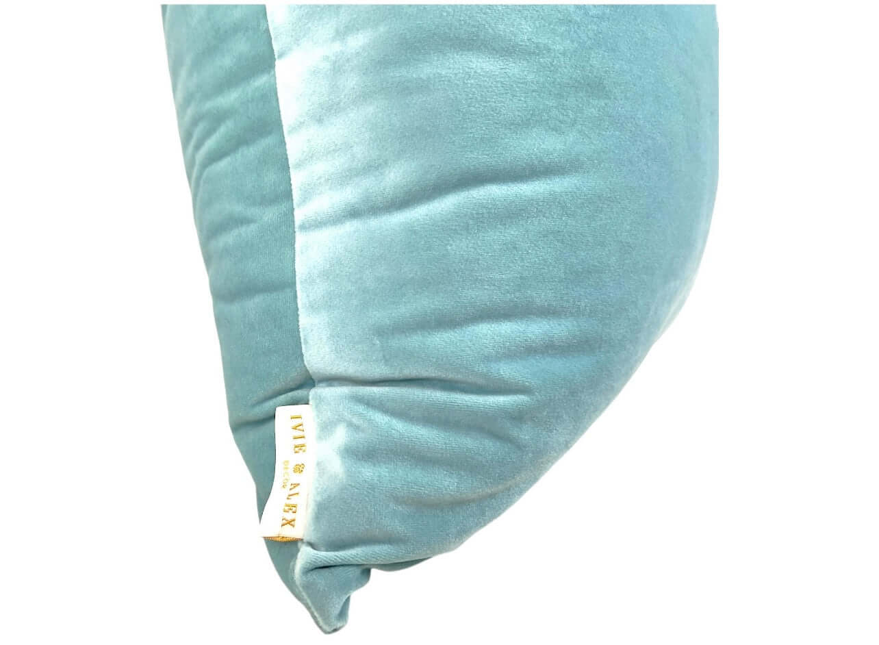 Closeup side view of the Luxury Velvet Pillow Cover in Aqua against a white background