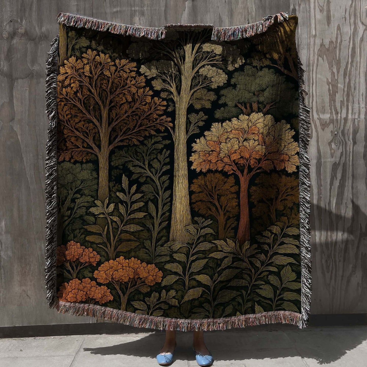 Autumn Forest Woven Blanket with Fringes featuring colorful trees and foliage, perfect for cozy fall decor.