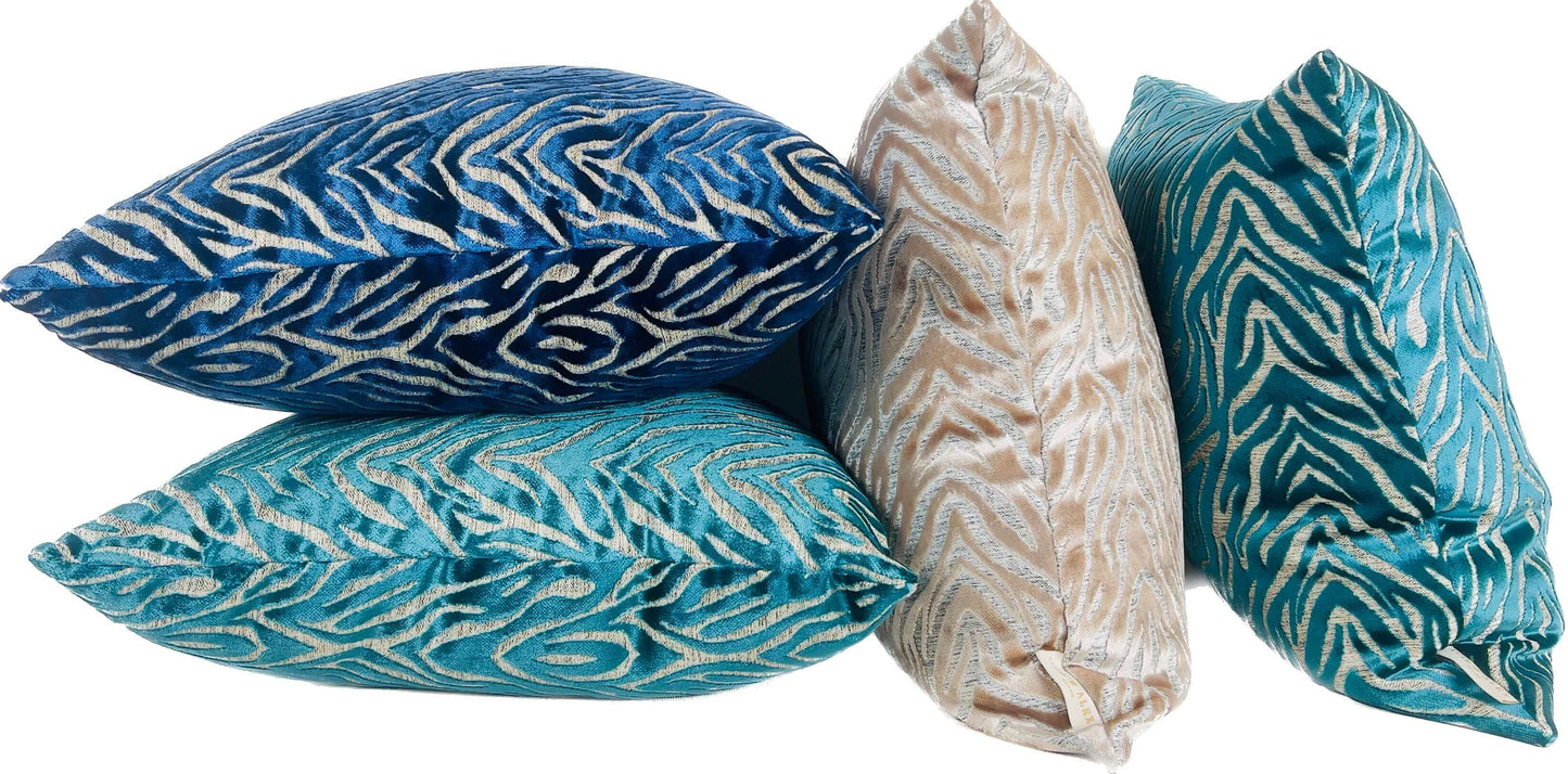 Tiger Pattern Cut Velvet Pillow Cover in Teal with beige and blue velvet pillows against a white background