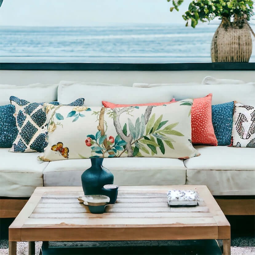 Kimono Vine Floral Cotton Lumbar Pillow Cover with a coral, blue and multicolor pillows on a white sofa