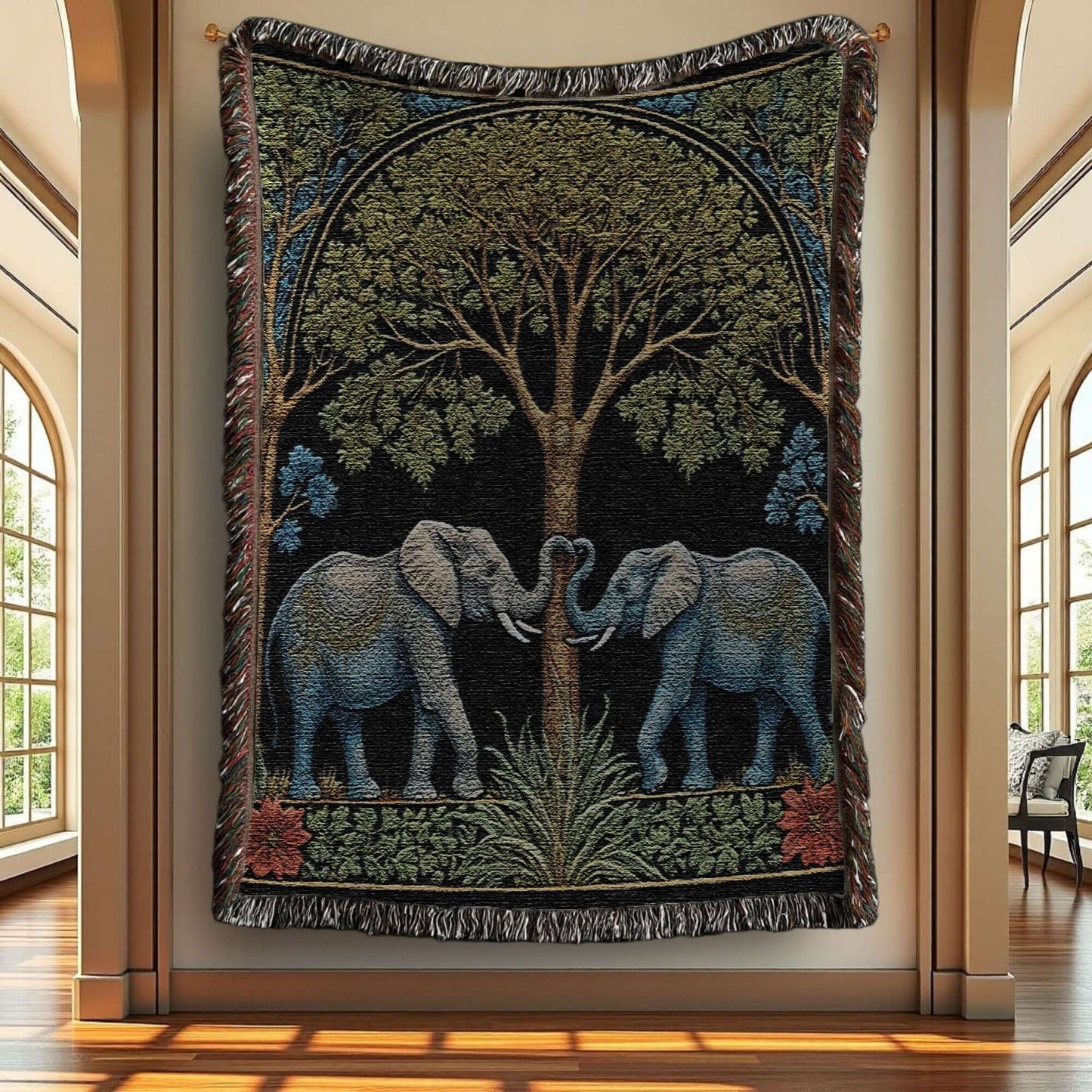 Two elephants on a woven fringed blanket hung up on a wall.