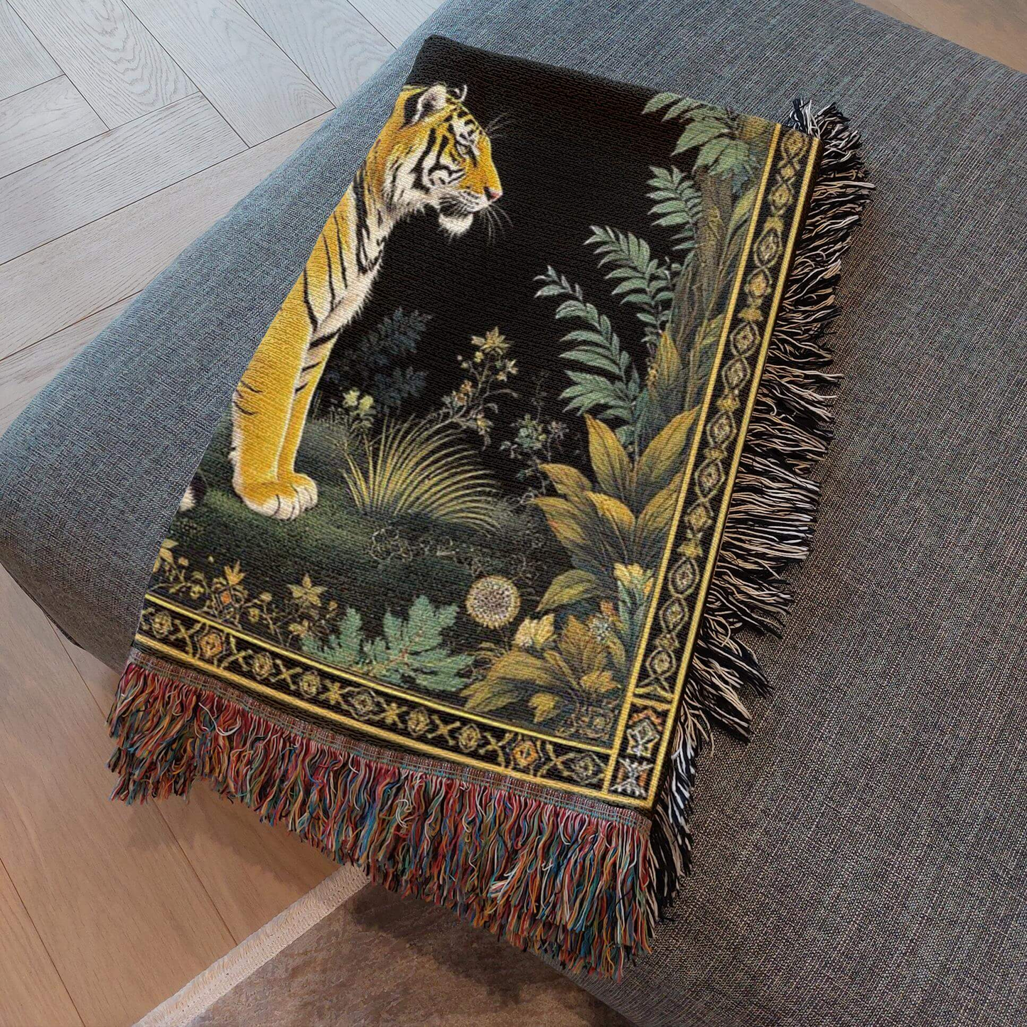 Exotic Tiger Woven Throw Blanket folded and resting on a gray ottoman