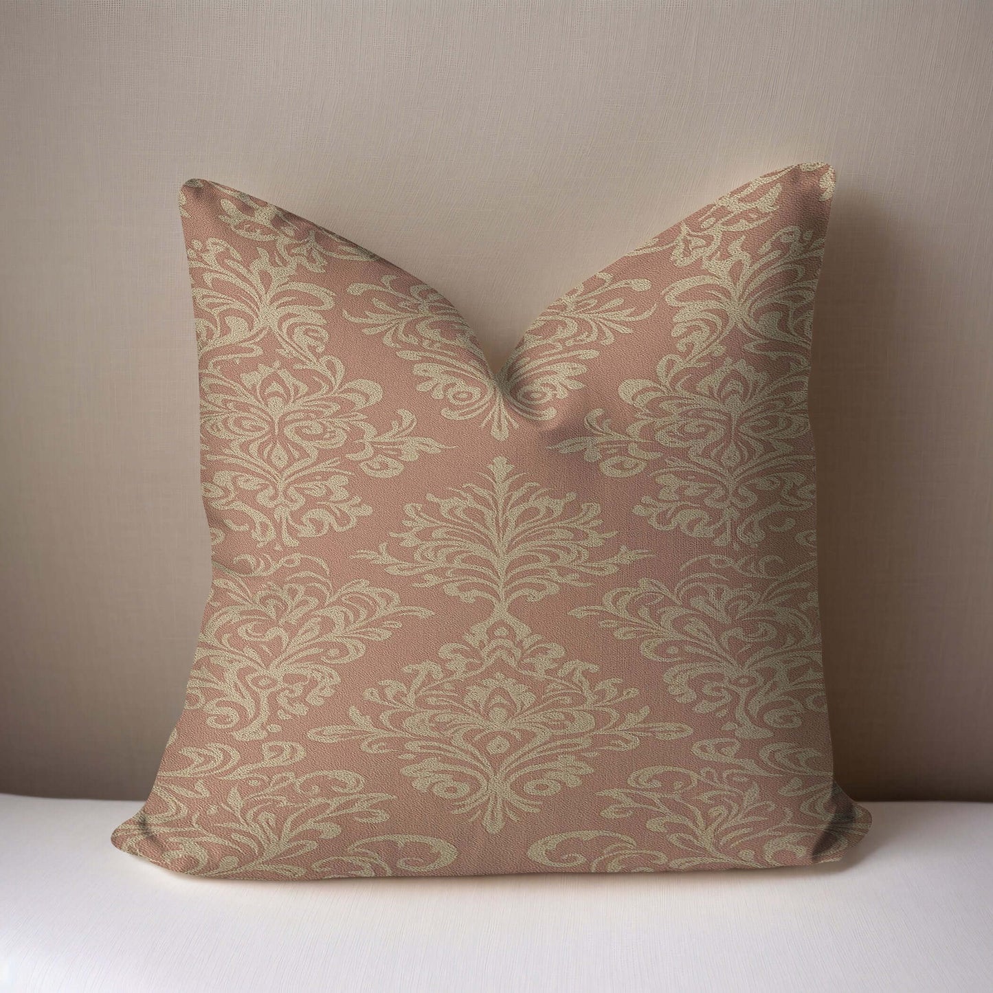 Pink and Beige Damask Woven Blanket showcasing a beautiful damask design on a soft pillow.