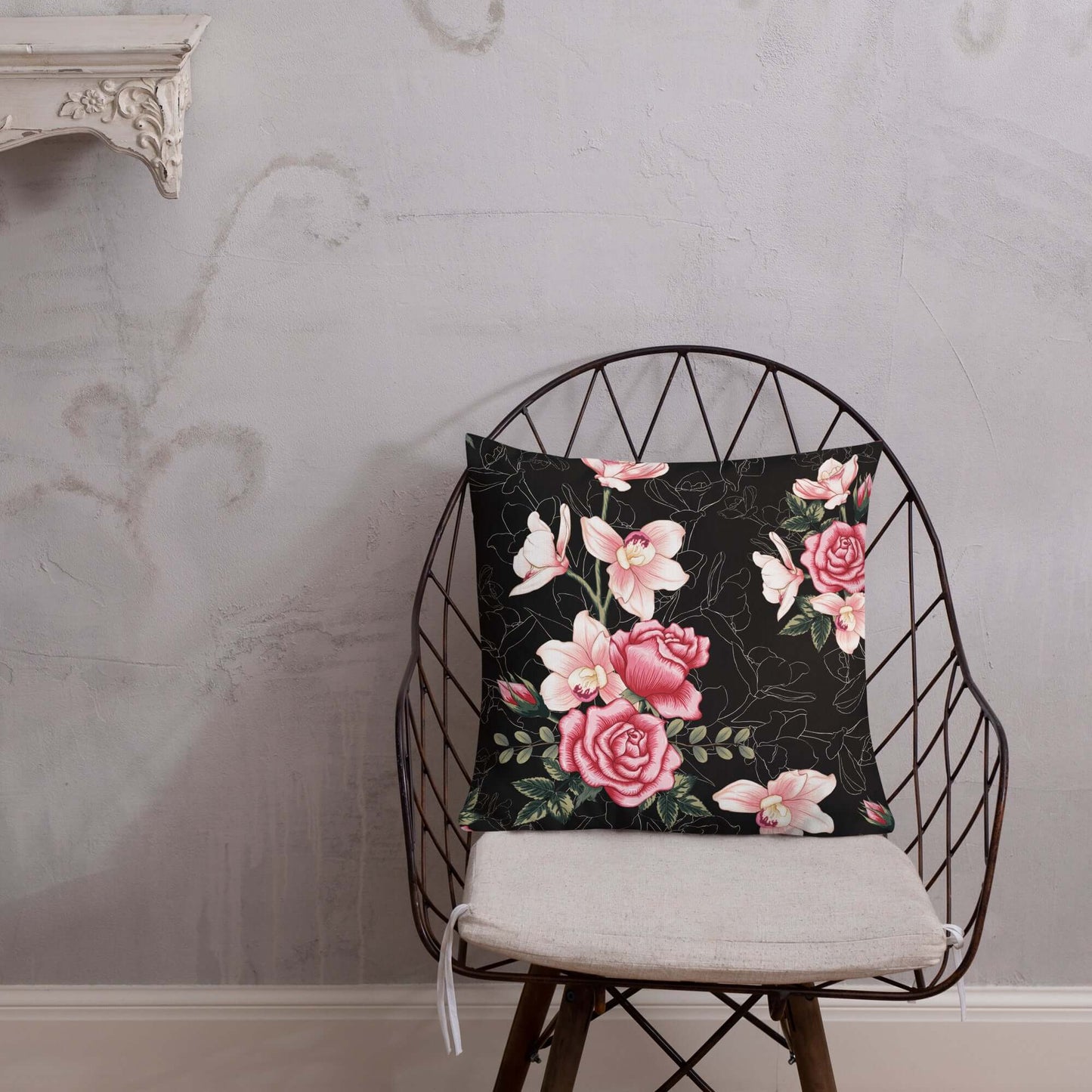 Floral Rose Pink and Black Pillow on a wooden chair.