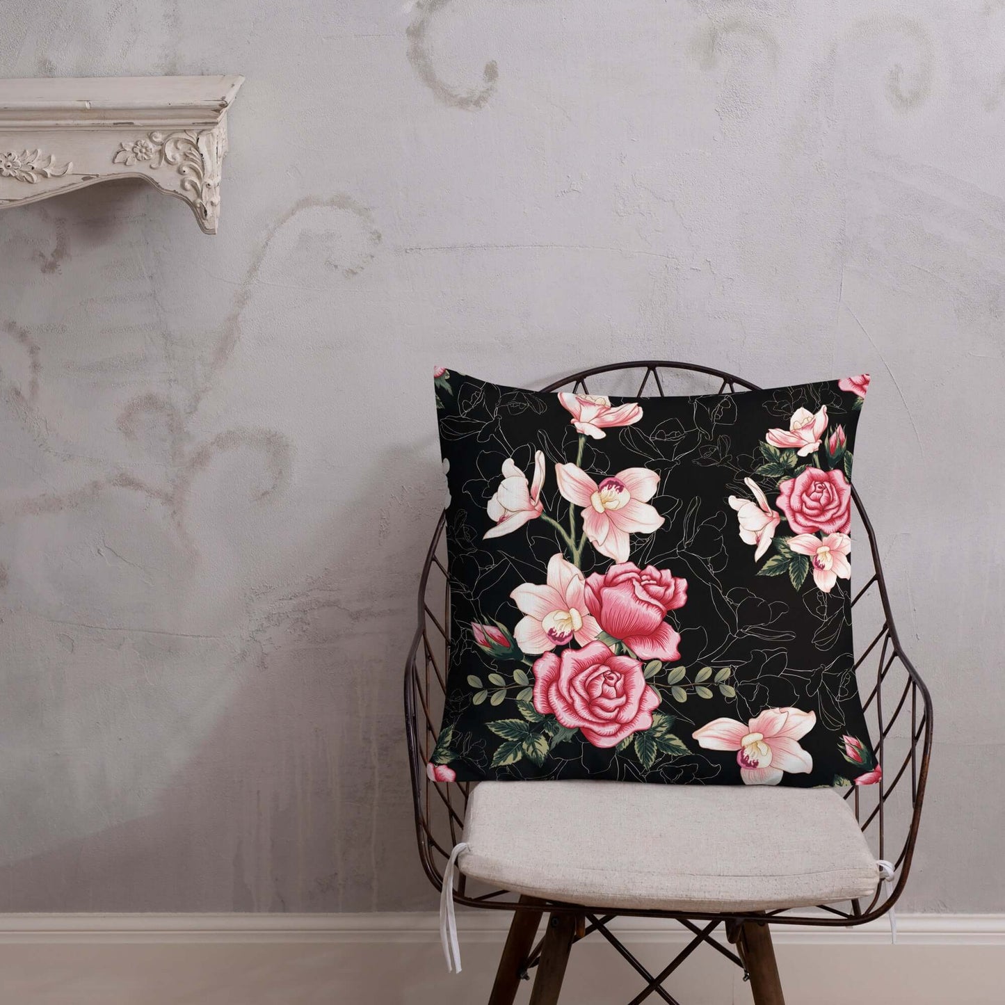 Floral Rose Pink and Black Pillow on a wooden chair.