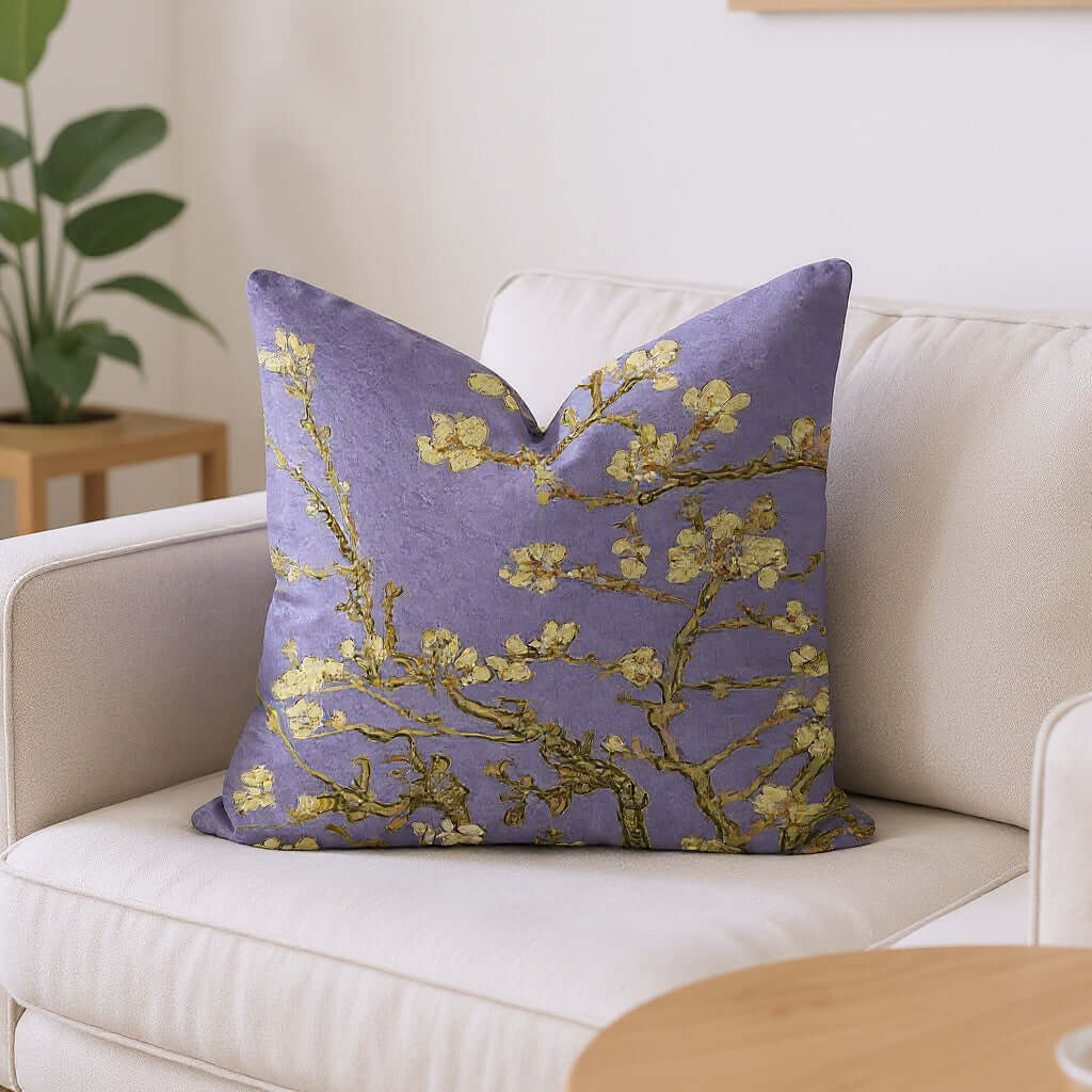 Van Gogh Almond Blossom Woven Pillow in Lavender in a white armchair with a plant in the background