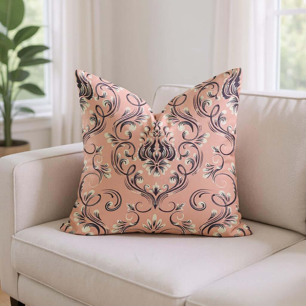 Pink And Navy Damask Woven Pillow on a light sofa, featuring a decorative floral damask pattern.
