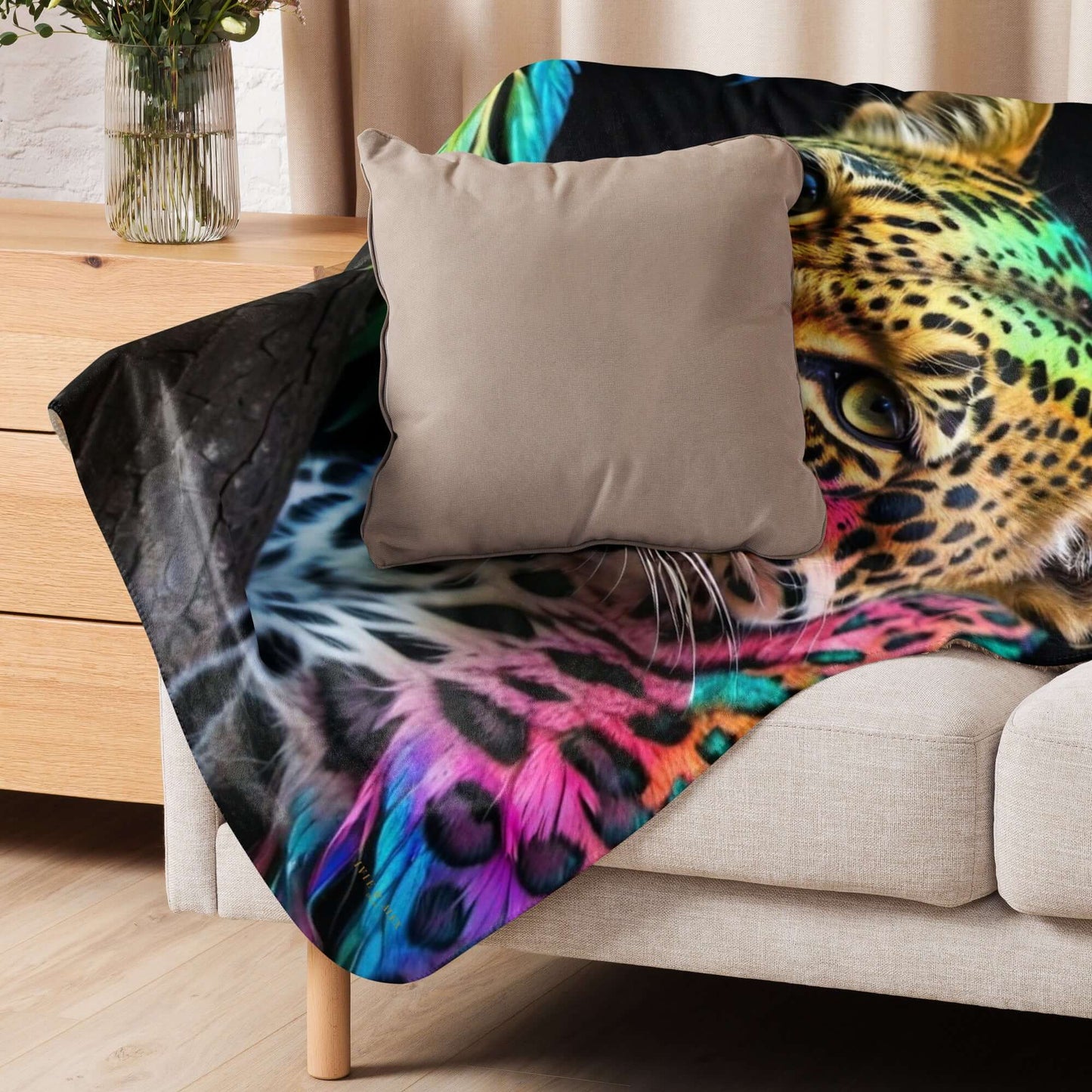 Neon Cheetah Printed Sherpa Blanket draped over a white sofa with a beige pillow