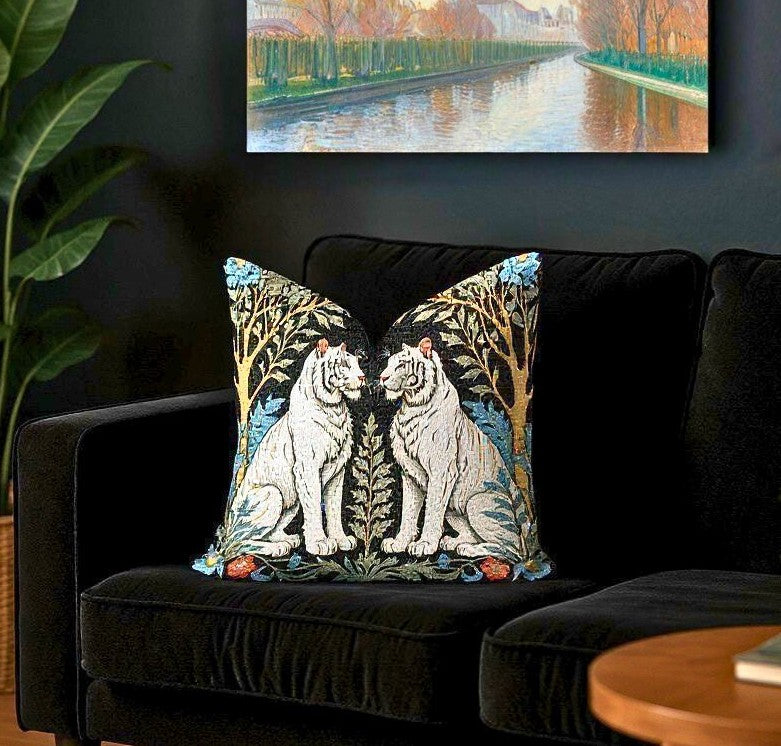 Close up of the Exotic White Tiger Woven Pillow on a black velvet sofa in a dark aesthetic living room