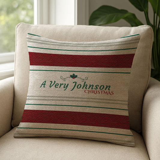 Personalized Dark Red Striped Christmas Pillow on a beige armchair next to a window