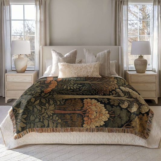Autumn Forest Woven Blanket with Fringes draped elegantly over a bed, showcasing intricate fall-themed designs.