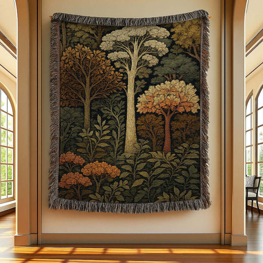Tapestry with forest design hanging on a wall in a room with large windows.