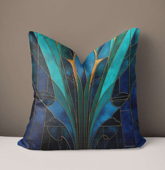 Blue And Teal Art Deco Woven Pillow on a white surface with a brown background