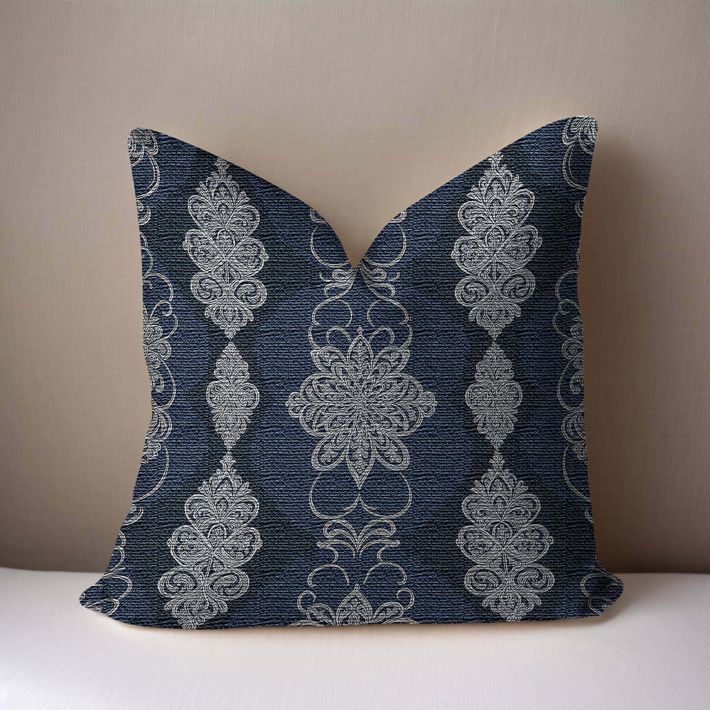 Navy White Damask Woven Pillow on a white surface with a taupe background.