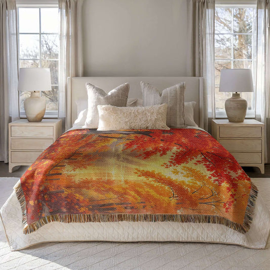 Bedroom with a bed covered by the Autumn Day Woven Blanket Tapestry
