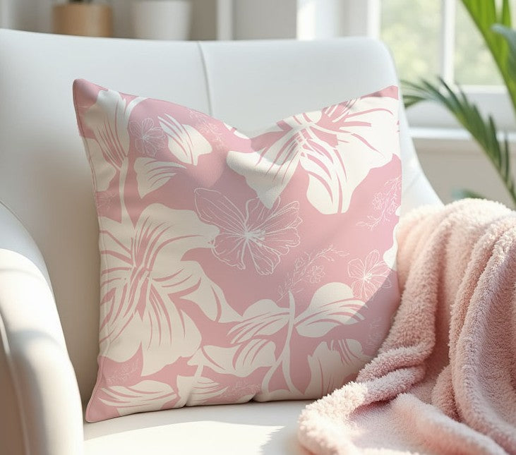 Pink and White Floral Pillow Cover on a white armchair with a pink blanket.