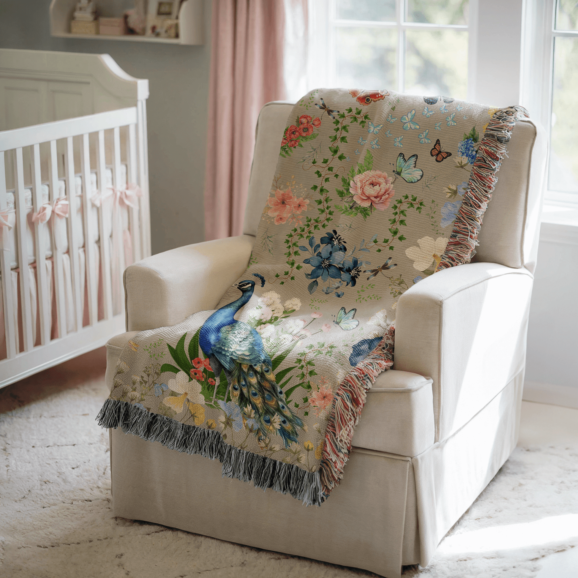 Gray Peacock Floral Woven Blanket with Fringes draped over a white chair in a nursery.