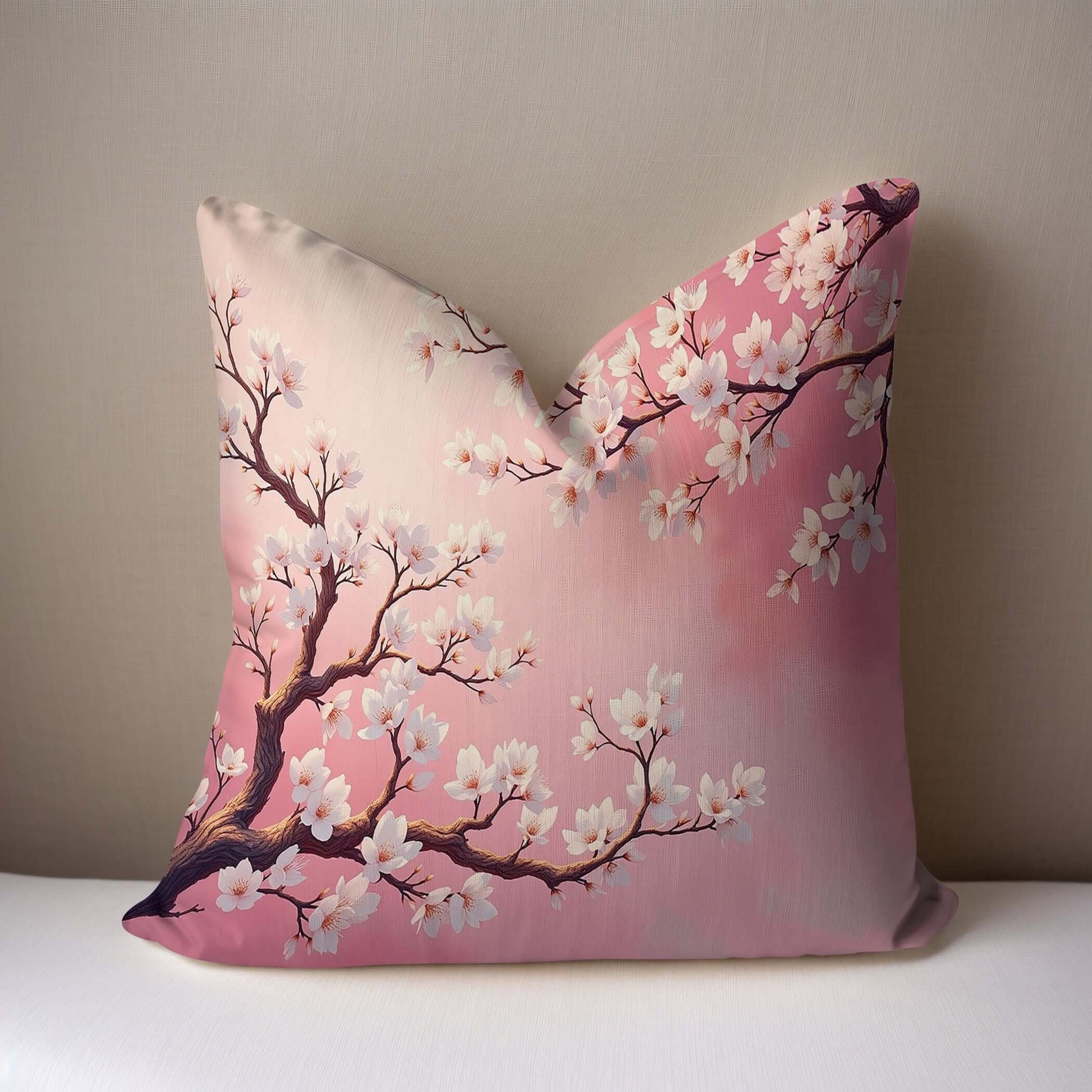 Pink Almond Blossom Woven Pillow on a white surface with a taupe background.