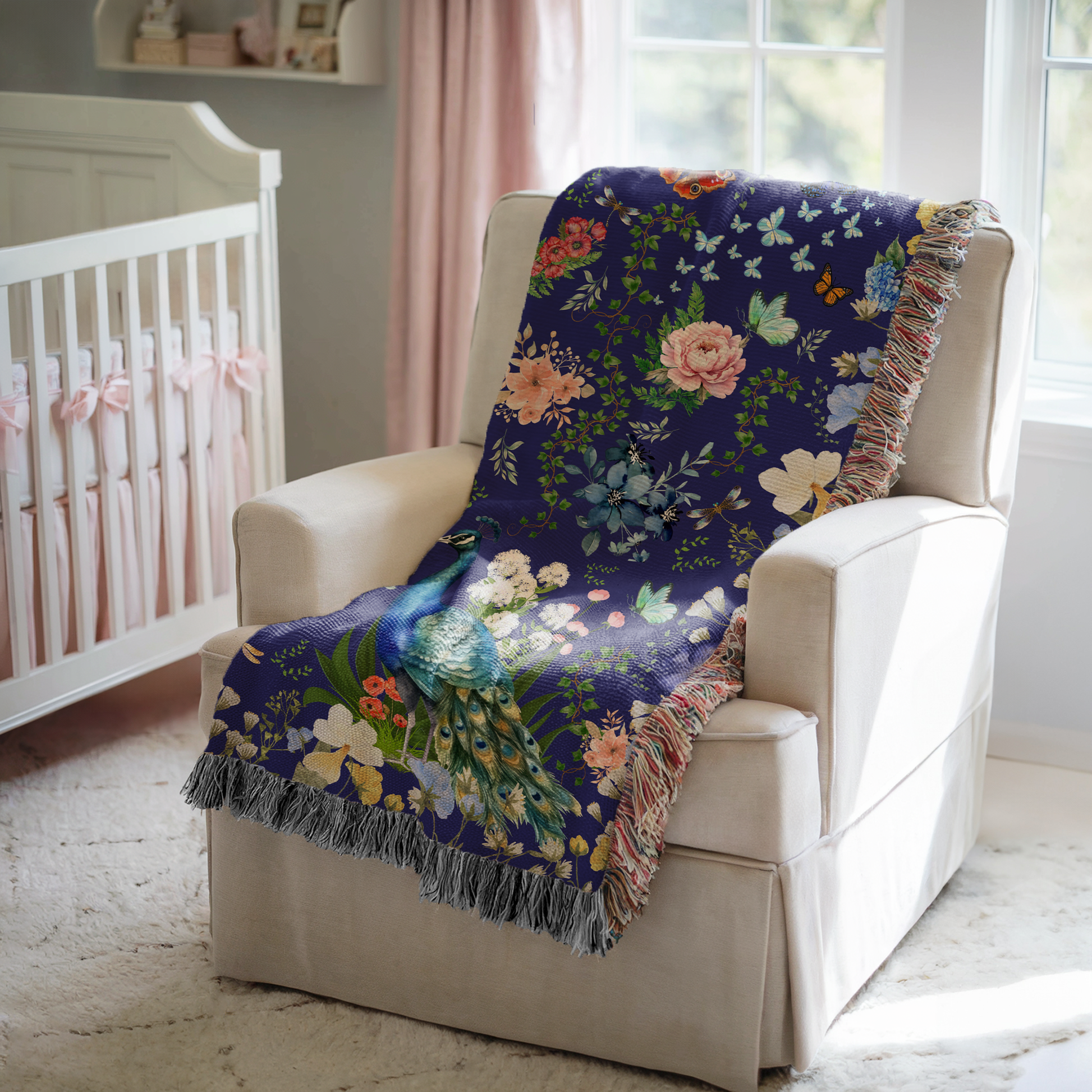 Blue Peacock Floral Woven Blanket with Fringes on a white chair in a baby nursery 