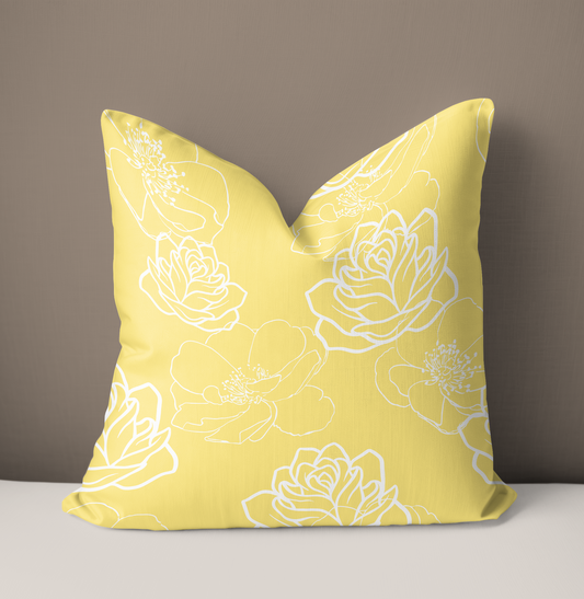 Yellow and white floral pillow