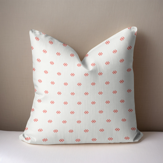 Coral and white geometric print pillow 