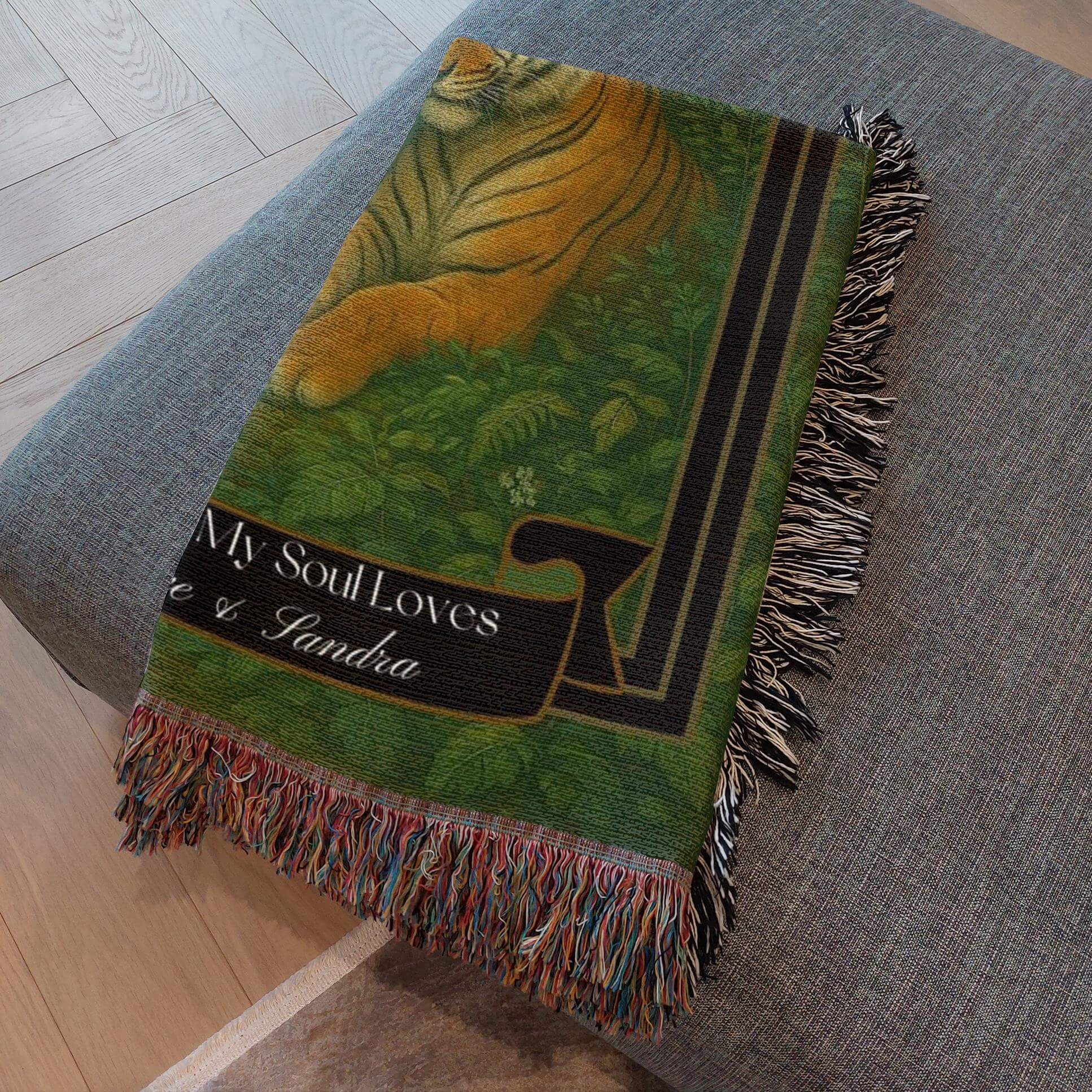 Personalized Tigers Couples Blanket folded and resting on a gray ottoman